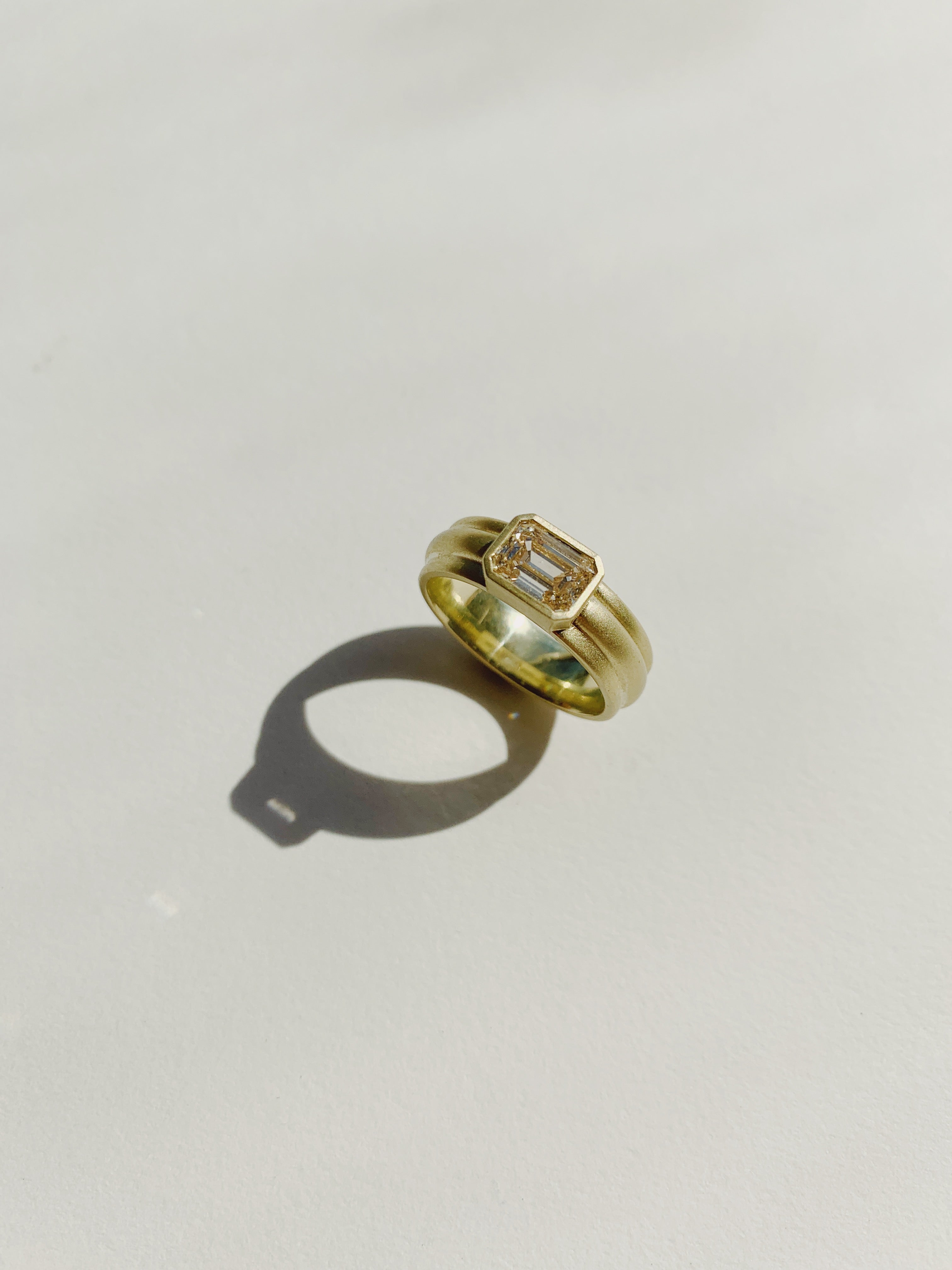 Wide Column Solitaire in 18k Green Gold with Emerald Cut Champagne Diamond